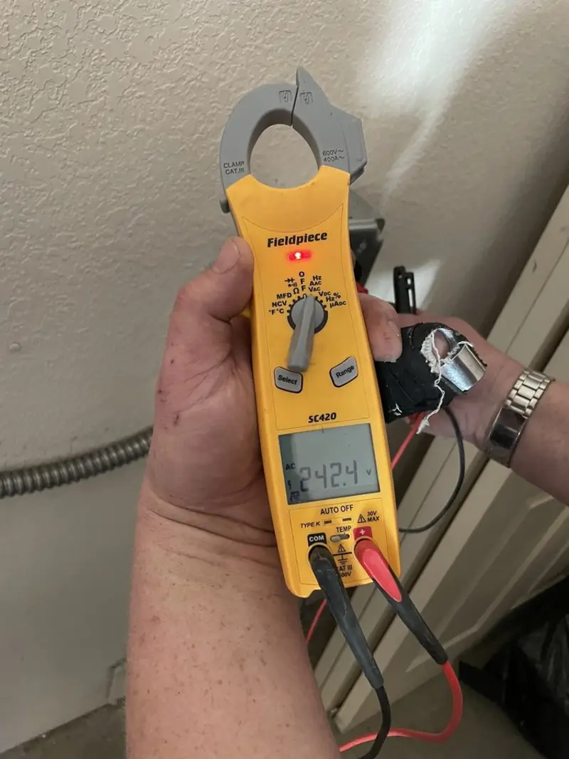 Voltage testing with clamp meter during Ceiling Fan Installation in Bangor